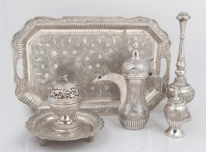 117 · A Persian silver tea service with engraved decoration and inscription "Presented To Mr. & Mrs. CHARLES F. EBSEN From Mr. & Mrs. ABDUL AZIZ ALGHANIM", mid 20th century, (5 items), ​​​​​​​the tray 47cm wide, 2656 grams total.