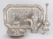 A Persian silver tea service with engraved decoration and inscription "Presented To Mr. & Mrs. CHARLES F. EBSEN From Mr. & Mrs. ABDUL AZIZ ALGHANIM", mid 20th century, (5 items), ​​​​​​​the tray 47cm wide, 2656 grams total.
