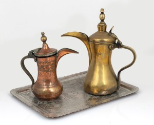 Two antique copper and brass Middle Eastern coffee pots together with a Persian silver plated tray, 19th/20th century, (3 items), the tray 36cm wide.