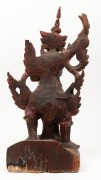 An antique Burmese carved wooden statue of a standing figure with remains of polychrome and gilt finish, 19th/20th century, 51.5cm high. - 2
