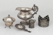 Chinese export silver mustard pot, Dutch silver tea strainer, Continental silver jug with inscription, lidded silver sugar pot and a pierced silver dish with holder, 19th/20th century, (6 items), 181 grams total.