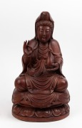 A Chinese carved wooden seated Guanyin statue, 20th century, 48cm high.