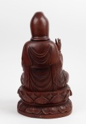 A Chinese carved wooden seated Guanyin statue, 20th century, 48cm high. - 2