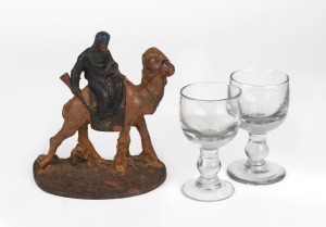 Two antique toast master's glasses; together with a reproduction cast iron doorstep of a Bedouin camel rider, (3 items), the largest 15cm high.