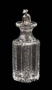 54 · An antique crystal scent bottle with figural Chinese silver dipping spoon, 19th/20th century, 9.5cm high.