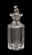 An antique crystal scent bottle with figural Chinese silver dipping spoon, 19th/20th century, 9.5cm high.