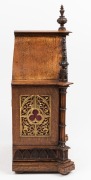 A good quality antique English Gothic Revival oak cased bracket clock with German ting tang gong striking movement, 19th century, ​​​​​​​57cm high. - 2
