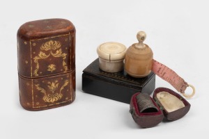 An antique bone and antler pill box, whalebone and vegetable ivory stanhope tape measure, antique snuffbox antique silver thimble in leather case, and an Italian embossed leather slip case, 19th/20th century, (5 items), the largest 7cm high.