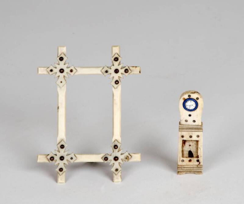 Folkart marine ivory sailors sweetheart picture frame (8 x 10.5cm) & miniature bone longcase clock with enamel dial (7.5cm), both 19th century. (2 items)