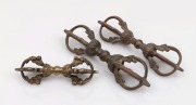 Three assorted bronze vajras, 19th/20th century, ​​​​​​​the largest 15.5cm long.