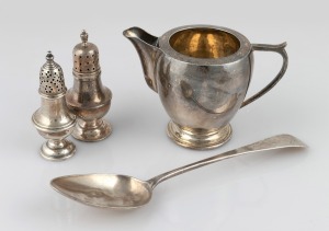 132 · A vintage cream jug stamped "SILVER", a Georgian sterling silver tablespoon, and two sterling silver pepper pots, (4 items), ​​​​​​​the spoon 22cm long, 234 grams total.