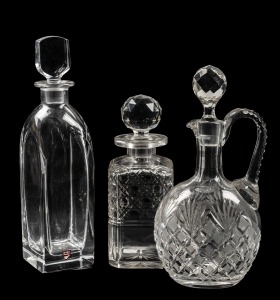 A hobnail cut crystal decanter; together with an ORREFORS Swedish crystal decanter and a cut crystal wine jug, 20th century, (3 items), ​​​​​​​the largest 31cm high.