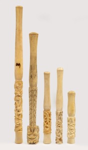Five assorted antique and vintage Chinese carved ivory cigarette holders, including an unusual dragon example, 19th/20th century, the largest 19cm long.
