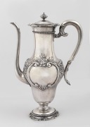 An antique American silver coffee pot by E. Caldwell & Co. of Philadelphia, 19th century, ​​​​​​​26cm high, 550 grams.