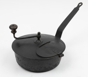 An antique stove top coffee roaster with hand crank, 19th century, ​​​​​​​18cm high, 43cm wide.
