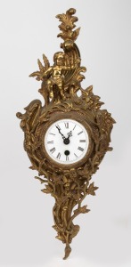 455 · Reproduction cartel clock in cast brass frame with quartz movement, 20th century, 52cm high.