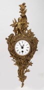 Reproduction cartel clock in cast brass frame with quartz movement, 20th century, 52cm high.
