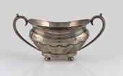 An antique English sterling silver sugar basin, by Walker & Hall of Sheffield, circa 1896, 10cm high, 20cm wide, 234 grams.