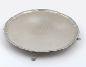 A sterling silver salver with engraved dedication, made in Sheffield, 20th century, 38cm wide, 1439 grams.