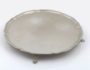A sterling silver salver with engraved dedication, made in Sheffield, 20th century, 38cm wide, 1439 grams.