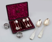 A pair of antique Scottish sterling silver tablespoons, assorted sterling silver teaspoons, tongs and two napkin rings, 19th/20th century, (10 items), ​​​​​​​278 grams total.
