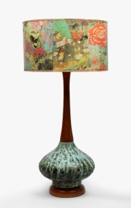 A vintage pottery and timber table lamp with parchment shade, circa 1960, 75cm high overall.
