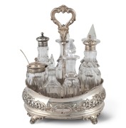 An antique English sterling silver and crystal cruet set, 19th century, ​​​​​​​24cm high, the base 409 grams including inset timber base.