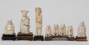 Four assorted Chinese carved ivory statues on wooden stands; together with a carved ivory "See No Evil" monkey figure group, 20th century, (5 items), the largest 13cm high.