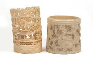 223 · Two Chinese carved ivory ornaments, decorated with landscapes and dragons, 19th/20th century, 8cm and 6cm high.