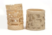 Two Chinese carved ivory ornaments, decorated with landscapes and dragons, 19th/20th century, 8cm and 6cm high.