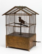 An antique French singing bird automaton in cage, with clockwork and bellows movement, 19th century, 48cm high.