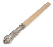 An antique ivory and sterling silver page turner, 19th century, ​​​​​​​31cm long.