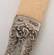 An antique ivory and sterling silver page turner, 19th century, ​​​​​​​31cm long. - 2
