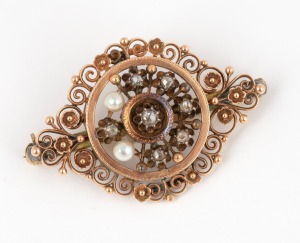 313 · An antique rose gold brooch adorned with diamonds and pearls, fitted with later 18ct gold clasp, 19th century. This piece may well have been part of a larger item, perhaps a tiara. ​​​​​​​4.5cm wide, 9.4 grams.