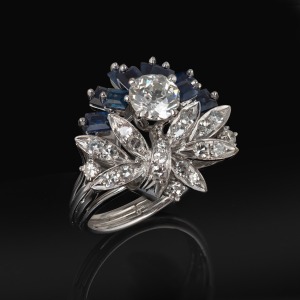 339 · An Art Deco 18ct white gold cocktail ring with diamonds and sapphires, mid 20th century, ​​​​​​​6.7 grams.