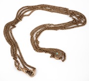 An antique 9ct rose gold double strand necklace with sliding heart link, set with turquoise and seed pearls, 19th century, 58cm long, 11.4 grams.