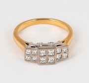 A vintage 18ct gold ring, set with twelve diamonds mounted in white gold surround, 6.9 grams.