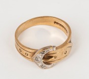 An antique English 9ct gold buckle ring, set with three white diamonds, 19th century, ​​​​​​​3.7 grams.