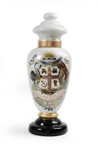APOTHECARY JAR: c1880s tall glass lidded jar with reverse glass painting of an emu & kangaroo flanking an Australian coat of arms titled "ADVANCE AUSTRALIA" with "Toilet Articles" written below. Height 66cm