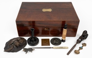 An antique mahogany box, advertising ware, bronze plaques depicting MOZART and DANTE, bronze sea turtle paperweight, antique timber wall bracket, tobacco cutter, cold-painted miniature dog figure, and a tribal silver spoon, mixed vintages (10 items). the 