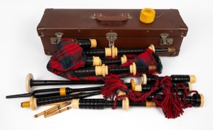 A set of antique ebony and ivory bagpipes in original case, manufactured by R. G. HARDIE of Glasgow, early to mid 20th century, the case 60cm wide.