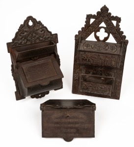 Three antique American wall mount cast metal match holders, 19th century, the largest 19cm high.