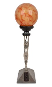 An Art Deco chrome figural based Diana table lamp with spherical glass shade, circa 1930s, 50cm high.