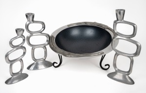 A contemporary metal ware fruit bowl on stand; together with three contemporary metal candlesticks, (4 items), the largest 36cm high.