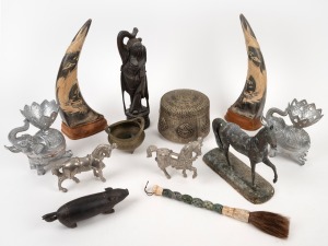 Assorted Chinese and Asian artefacts, censer, calligraphy brush, carved horns, metal ware, horse statues, elephant ornaments and a tribal pig statue, 20th century, (12 items), the largest 31cm high.