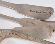 A Georgian sterling silver tablespoon, sugar tongs and two antique sterling silver sauce ladles, early to mid 19th century, (4 items), the largest 21.5cm long, 182 grams total. - 2