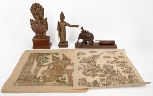 Vintage Burmese carved polychrome statue, peacock statue mounted on later wooden base, a Burmese carved timber and ivory elephant logging figure and a Thai rubbing, 20th century, (4 items), the largest 44cm high overall.