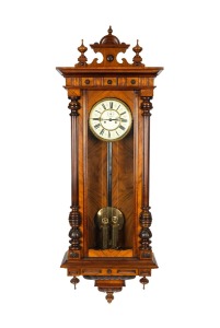 446 · An antique German weight driven regulator wall clock in walnut case with turned half columns, time and strike movement and Roman numerals, late 19th century, 133cm high.