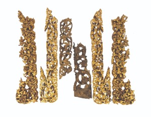 Six assorted antique and vintage Burmese carved wooden panels with figural decoration, with gilded finish and inlaid with glass, early to mid 20th century, the largest 112cm high.