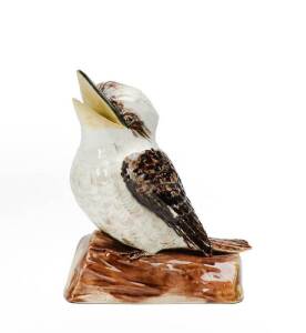 GRACE SECCOMBE: Kookaburra pearched on a log with mouth open. Incised signature & remains of paper label. 16cm